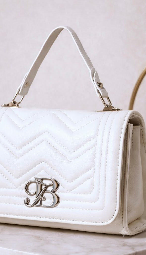 The Ivory Monogram Quilted Satchel