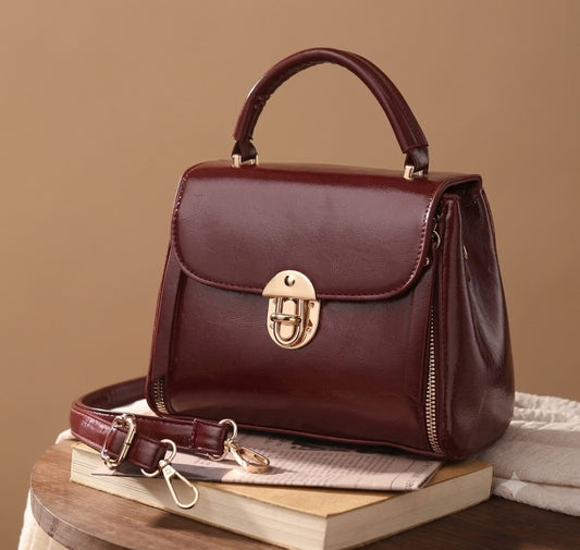 The Vintage Burgundy Twist-Lock Satchel